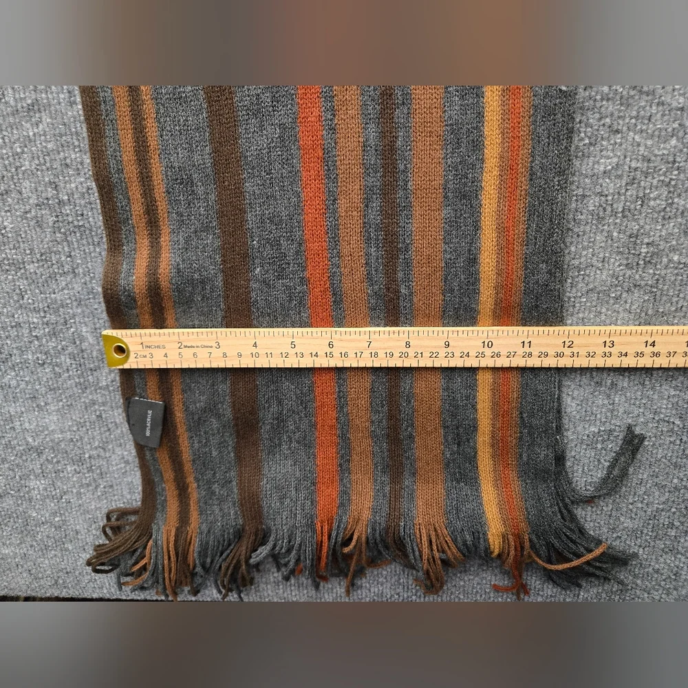 Womens Scarf featuring multicolor stripes and fringe ends. Perfect Pop Of Color‎